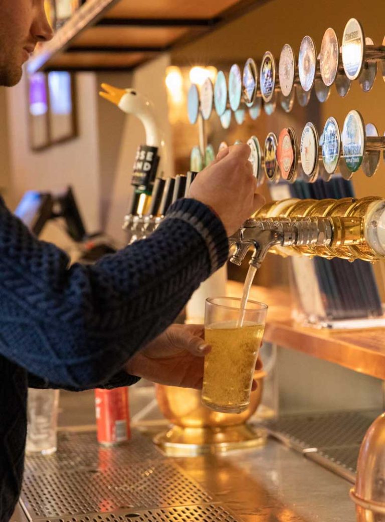 Bartender pouring a beer